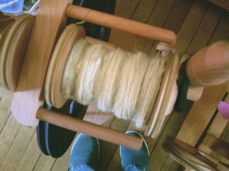 some of the natural, spun up into singles--my plan is to do one strand multicolored alternating with natural, ply with natural